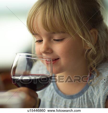 Blond child sniffing a glass View Large Photo Image Stock Image - Blond child sniffing a glass. Fotosearch
