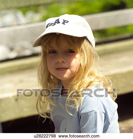 Blond little girl looking at camera View Large Photo Image Stock Photo - Blond little girl looking at camera. Fotosearch