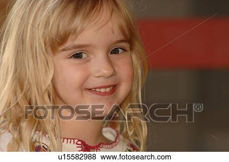 Cose up of girl smiling at camera View Large Photo Image Stock Photo - Cose up of girl smiling at camera. Fotosearch