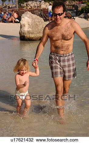 Stock Image - Father and Daughter in Water. Fotosearch