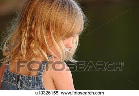 Rear view of a young girl sitting View Large Photo Image Stock Photography - Rear view of a young girl sitting. Fotosearch