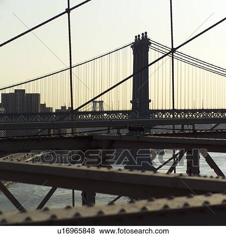 View of Manhattan Bridge from Brooklyn Bridge, New York City View Large Photo Image Stock Photo - View of Manhattan Bridge from Brooklyn Bridge, New York City. Fotosearch
