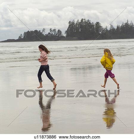 Children running on beach View Large Photo Image Stock Photograph - Children running on beach. Fotosearch
