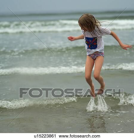 Young girl jumping in the water View Large Photo Image Stock Image - Young girl jumping in the water. Fotosearch