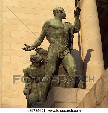 Low angle view of the statue of two men on a building, Havana, Cuba View Large Photo Image Stock Image - Low angle view of the statue of two men on a building, Havana, Cuba. Fotosearch