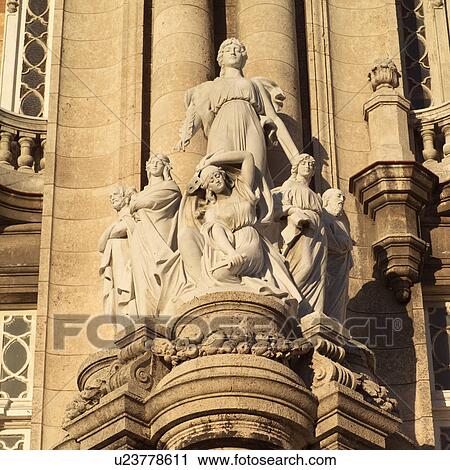 Stock Image - Stone statue on a building. Fotosearch