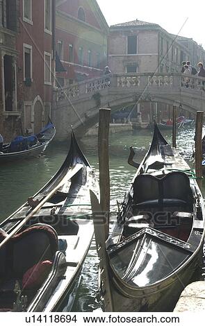Picture - Array of gondolas docked at a canal in Venice, Italy. Fotosearch