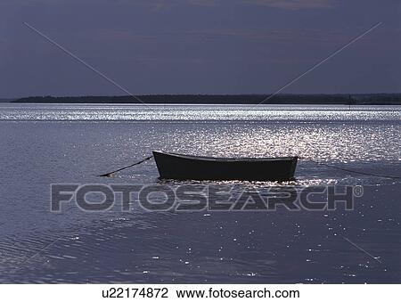 Stock Image - Boat Out at Sea. Fotosearch