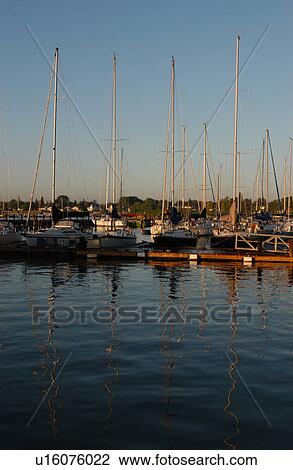 Boats docked at a harbor View Large Photo Image Stock Image - Boats docked at a harbor. Fotosearch