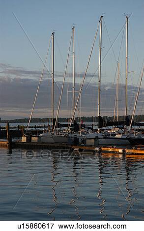 Stock Photo - Boats docked at a harbor. Fotosearch