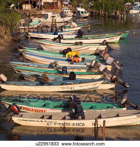 Boats lined up at shoreline View Large Photo Image Stock Image - Boats lined up at shoreline. Fotosearch