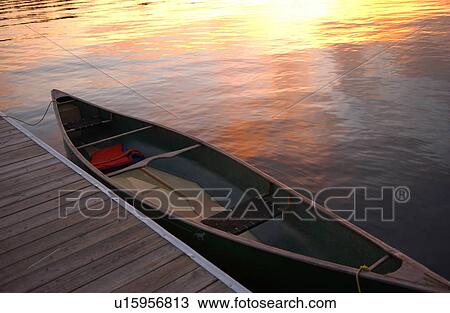 Canoe tied to a pier at Lake of the woods, Ontario, Canada View Large Photo Image Stock Image - Canoe tied to a pier at Lake of the woods, Ontario, Canada. Fotosearch