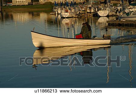 Stock Image - Man in Boat. Fotosearch