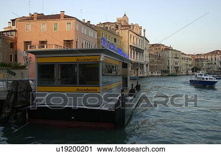 Stock Image - Passenger boat docked in a canal. Fotosearch