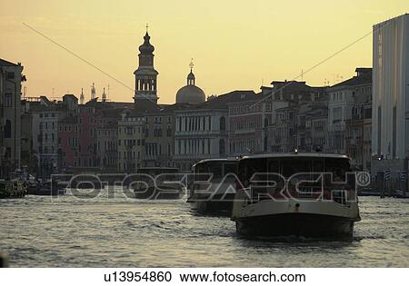 Passenger boats moving in a canal View Large Photo Image Stock Image - Passenger boats moving in a canal. Fotosearch