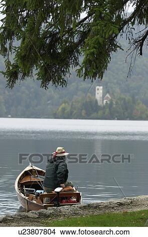 Picture - Person in a boat. Fotosearch
