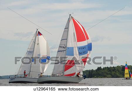 Sailing boats sailing in Lake of the woods, Ontario, Canada View Large Photo Image Stock Photography - Sailing boats sailing in Lake of the woods, Ontario, Canada. Fotosearch
