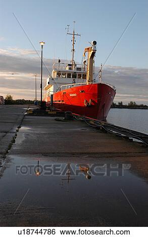 Ship docked at a harbor View Large Photo Image Stock Photograph - Ship docked at a harbor. Fotosearch