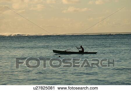 Silhouette of a man rowing a boat in the sea View Large Photo Image Stock Image - Silhouette of a man rowing a boat in the sea. Fotosearch