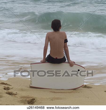 Boy Sitting on Bodyboard View Large Photo Image Stock Photo - Boy Sitting on Bodyboard. Fotosearch