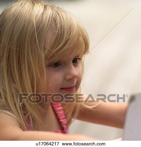 Close-up of a young girls face View Large Photo Image Stock Photo - Close-up of a young girls face. Fotosearch