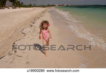 Stock Photo - Girl Running on the Beach. Fotosearch