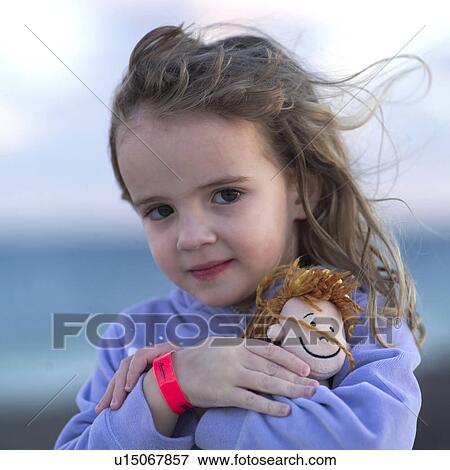 Stock Photo - Girl with Doll. Fotosearch