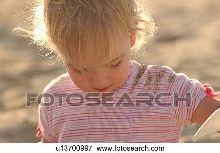 Kids playing on beach View Large Photo Image Stock Photo - Kids playing on beach. Fotosearch