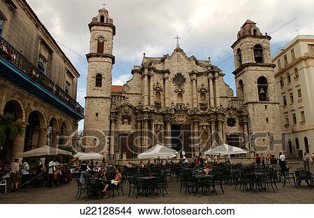 Group of people sitting at a sidewalk cafe in front of a church, Havana, Cuba View Large Photo Image Picture - Group of people sitting at a sidewalk cafe in front of a church, Havana, Cuba. Fotosearch