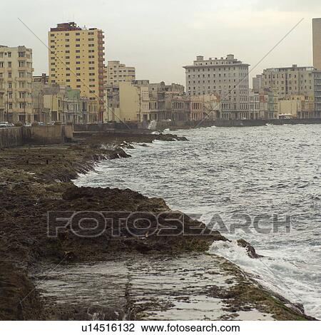 Stock Image - Buildings along shore, Havana, Cuba. Fotosearch