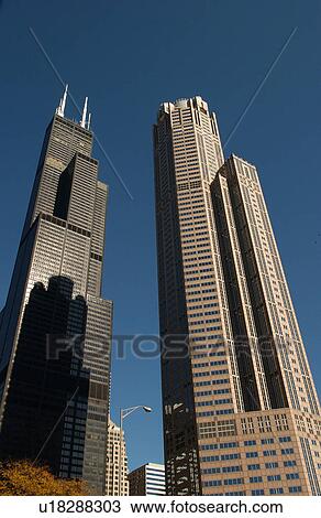 Stock Image - Low angle view of high rise buildings in Chicago. Fotosearch
