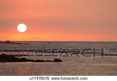 Stock Photo - Big Island of Hawaii - sunset from beach. Fotosearch