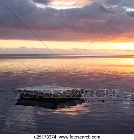 Picture - Floating Dock at Sunset at Moorea in Tahiti. Fotosearch