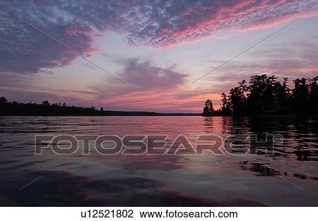 Lake Photography - Sunset over water at lake View Large Photo Image Stock Image - Lake Photography - Sunset over water at lake. Fotosearch