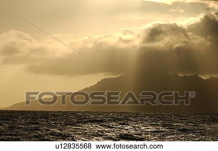 Panoramic view of clouds obscuring the sun over the sea, Moorea, Tahiti, French Polynesia, South Pacific View Large Photo Image Stock Photo - Panoramic view of clouds obscuring the sun over the sea, Moorea, Tahiti, French Polynesia, South Pacific. Fotosearch