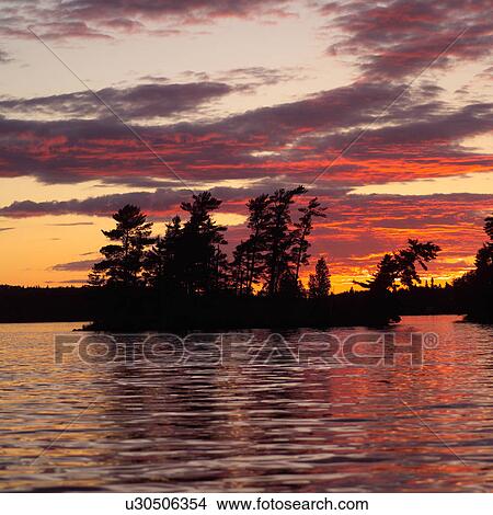 Sunset on Lake of the woods, Ontario, Canada View Large Photo Image Picture - Sunset on Lake of the woods, Ontario, Canada. Fotosearch