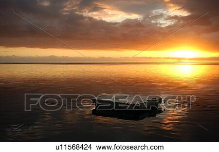 The sun setting on the sea, Moorea, Tahiti, French Polynesia, South Pacific View Large Photo Image Picture - The sun setting on the sea, Moorea, Tahiti, French Polynesia, South Pacific. Fotosearch