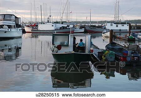 Boats docked at a harbor in Gimli, Manitoba, Canada View Large Photo Image Stock Photography - Boats docked at a harbor in Gimli, Manitoba, Canada. Fotosearch
