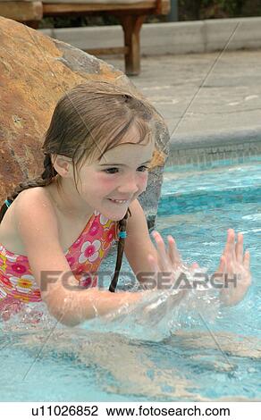 Close-up of a young girl (12 -13) playing in water, Moorea, Tahiti, French Polynesia, South Pacific View Large Photo Image Stock Image - Close-up of a young girl (12 -13) playing in water, Moorea, Tahiti, French Polynesia, South Pacific. Fotosearch