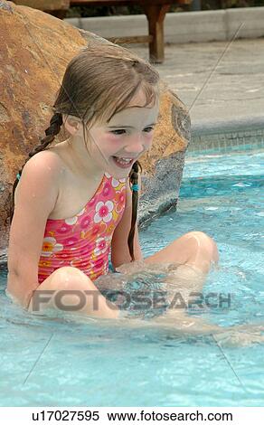 Close-up of a young girl (12-13) playing in water Moorea, Tahiti, French Polynesia, South Pacific View Large Photo Image Stock Photography - Close-up of a young girl (12-13) playing in water Moorea, Tahiti, French Polynesia, South Pacific. Fotosearch