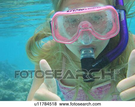 Close-up of a young woman scuba diving, Moorea, Tahiti, French Polynesia, South Pacific View Large Photo Image Stock Photo - Close-up of a young woman scuba diving, Moorea, Tahiti, French Polynesia, South Pacific. Fotosearch