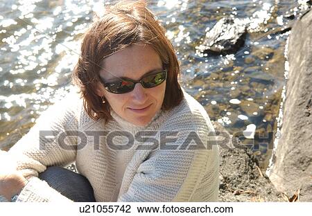 Female sitting at Water's Edge View Large Photo Image Stock Image - Female sitting at Water's Edge. Fotosearch