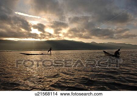 Picture - Fisherman leg rowing. Fotosearch