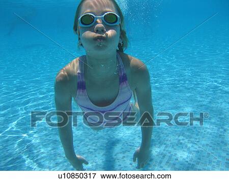 Underwater view of a young girl swimming, Moorea, Tahiti, French Polynesia, South Pacific View Large Photo Image Stock Photo - Underwater view of a young girl swimming, Moorea, Tahiti, French Polynesia, South Pacific. Fotosearch