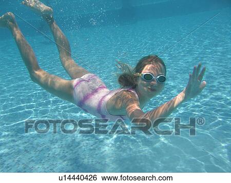 Underwater view of a young girl swimming, Moorea, Tahiti, French Polynesia, South Pacific View Large Photo Image Stock Photograph - Underwater view of a young girl swimming, Moorea, Tahiti, French Polynesia, South Pacific. Fotosearch