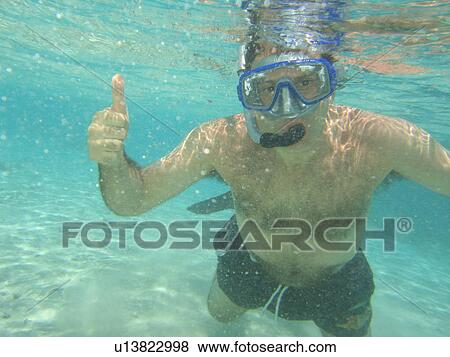 Underwater view of a young man scuba diving, Moorea, Tahiti, French Polynesia, South Pacific View Large Photo Image Stock Photo - Underwater view of a young man scuba diving, Moorea, Tahiti, French Polynesia, South Pacific. Fotosearch