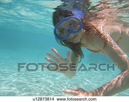 Underwater view of a young woman scuba diving, Moorea, Tahiti, French Polynesia, South Pacific View Large Photo Image Picture - Underwater view of a young woman scuba diving, Moorea, Tahiti, French Polynesia, South Pacific. Fotosearch