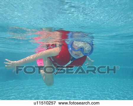 Underwater view of a young woman wearing scuba gear, Moorea, Tahiti, French Polynesia, South Pacific View Large Photo Image Stock Photo - Underwater view of a young woman wearing scuba gear, Moorea, Tahiti, French Polynesia, South Pacific. Fotosearch