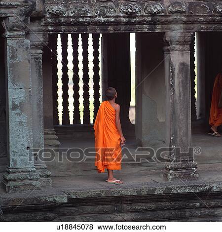 Back view of young monk at Khmer Kingdom palace ruins View Large Photo Image Stock Photo - Back view of young monk at Khmer Kingdom palace ruins. Fotosearch