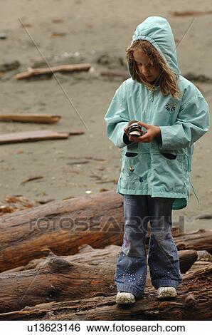 Little girl in blue jacket on beach, Florencia Bay, Vancouver Island, Canada View Large Photo Image Stock Photograph - Little girl in blue jacket on beach, Florencia Bay, Vancouver Island, Canada. Fotosearch